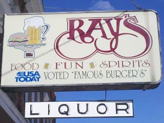 Sign for Ray's featuring food, fun, spirits, and liquor, noted for "famous burgers" by USA Today.