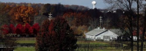 fall colors country scene with white water tower